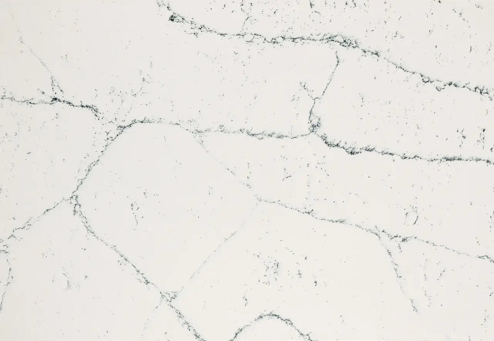 Quartz slab surface with light gray base and dark gray veining — premium countertop fabrication by Signature Stone Las Vegas