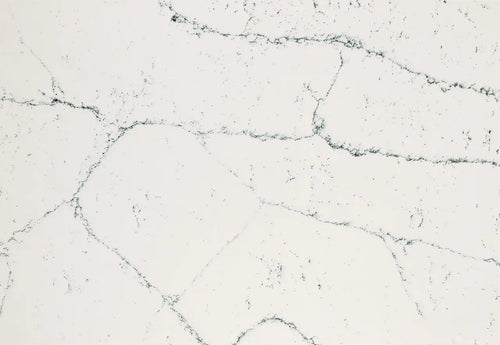 Quartz slab surface with light gray base and dark gray veining — premium countertop fabrication by Signature Stone Las Vegas