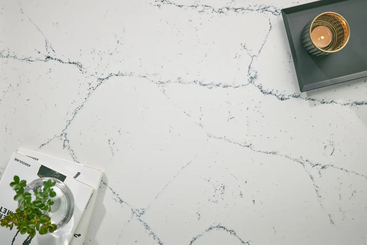 Quartz countertop surface with white background and gray veining in marble pattern — custom countertops fabricated and installed by Signature Stone LV