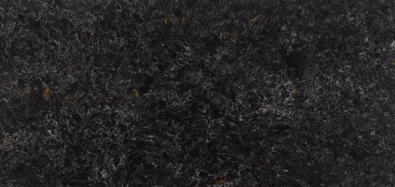 Dark granite surface with charcoal and black speckled pattern and polished finish — premium countertop fabrication by Signature Stone Las Vegas
