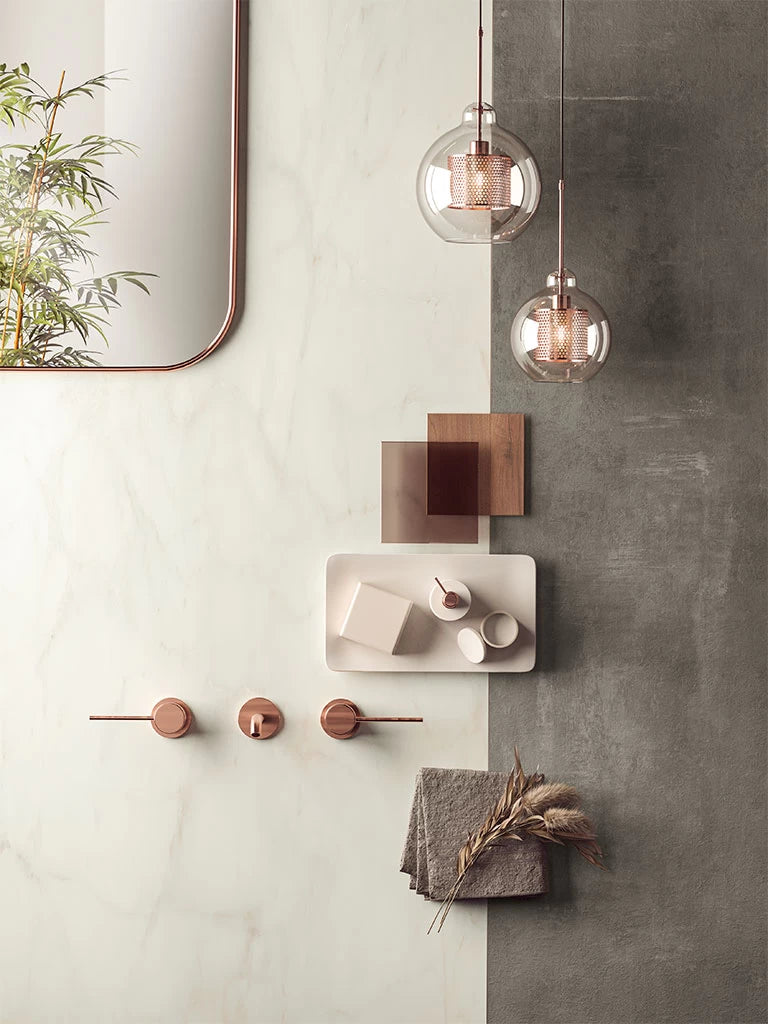 Calacatta Delicato quartz surfaces with white veining and copper accents — premium countertop fabrication by Signature Stone Las Vegas
