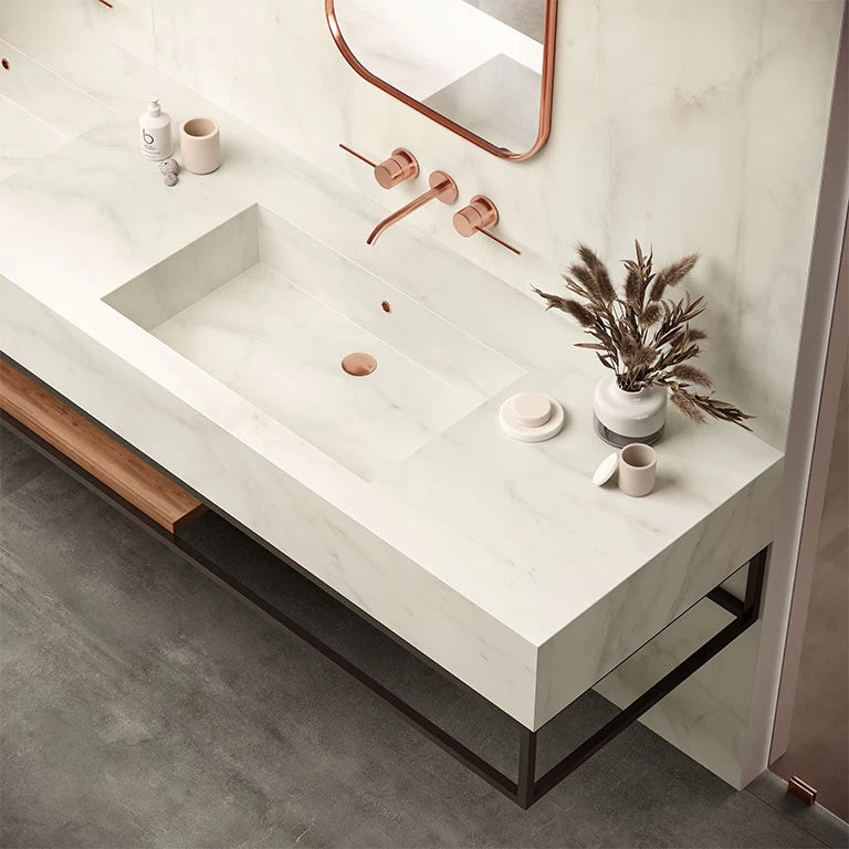 Calacatta Delicato bathroom vanity with white veining and integrated sink — elegant stone countertops installed by Signature Stone Las Vegas