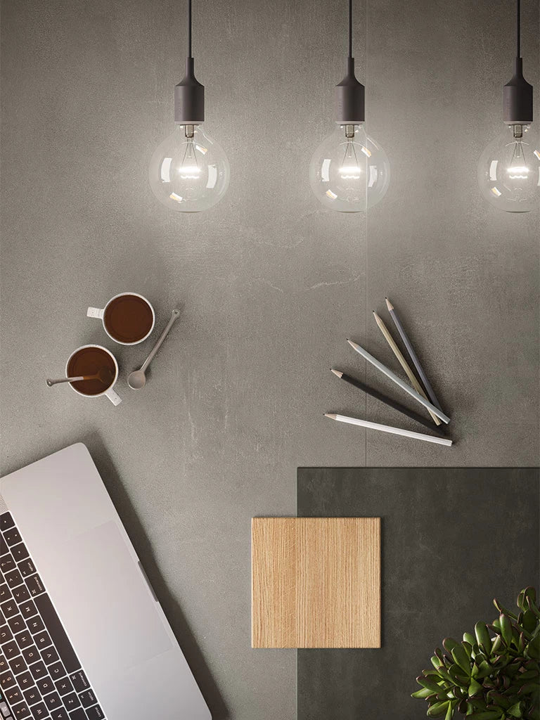 Boost Grey engineered stone surface with smooth matte finish and modern workspace setup — premium stone countertops installed by Signature Stone Las Vegas