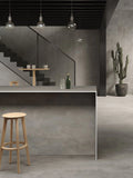 Boost Grey quartz kitchen island with sleek matte finish and straight edges — modern stone countertops installed by Signature Stone Las Vegas