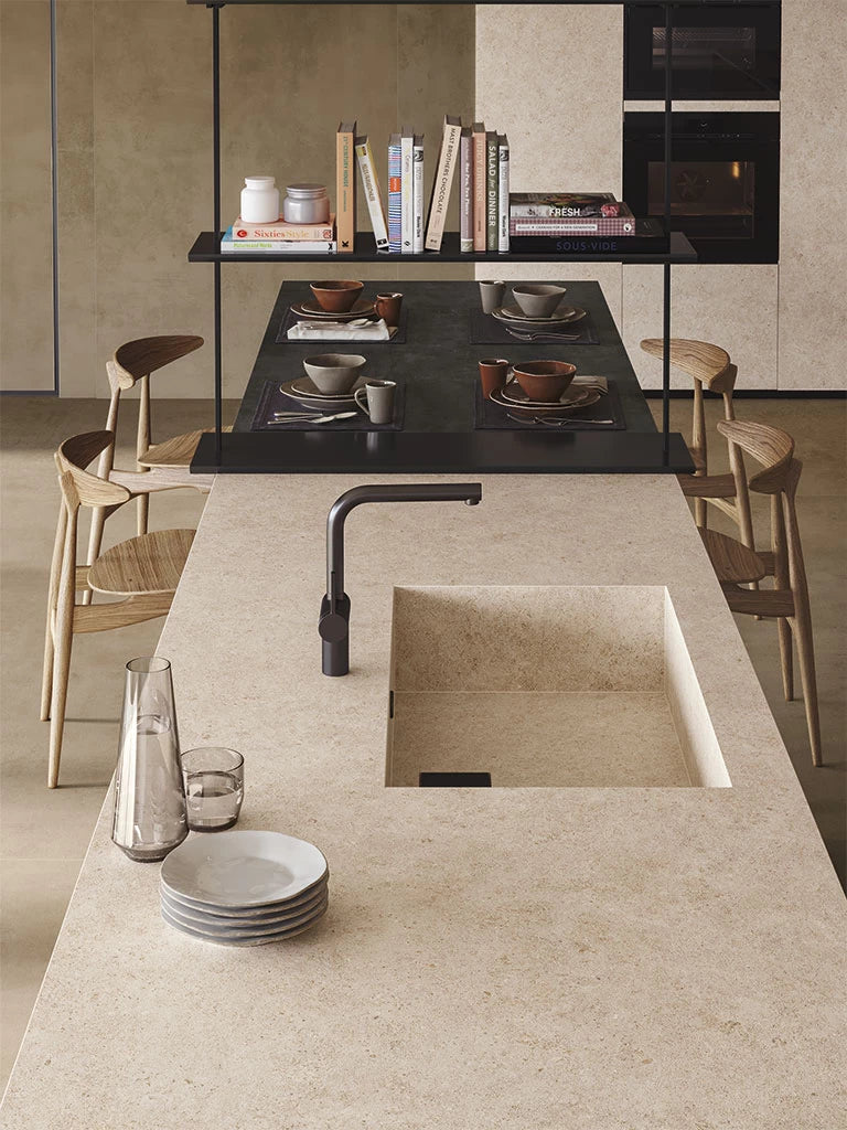 Boost Stone Ivory kitchen island with integrated sink featuring smooth beige finish — premium stone countertops installed by Signature Stone Las Vegas
