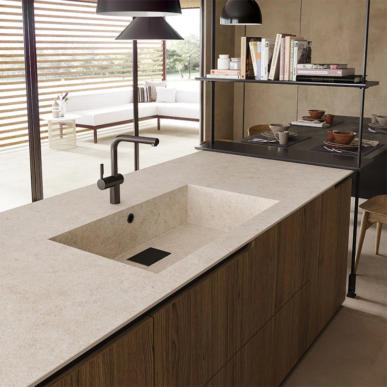 Boost Stone Ivory kitchen island with integrated sink featuring beige speckled finish — expert countertop fabrication by Signature Stone Las Vegas