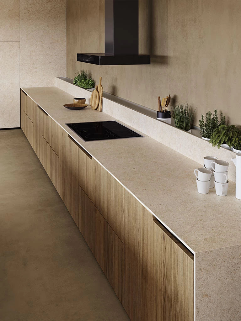 Boost Stone Ivory kitchen island with smooth beige finish and modern edge — premium stone countertops installed by Signature Stone Las Vegas