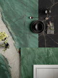 Exotic marble flooring with stunning green veining and black accent tiles — premium stone countertops installed by Signature Stone Las Vegas