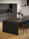 Black Atlantis quartz kitchen island with dramatic white veining and waterfall edge — premium stone countertops installed by Signature Stone Las Vegas