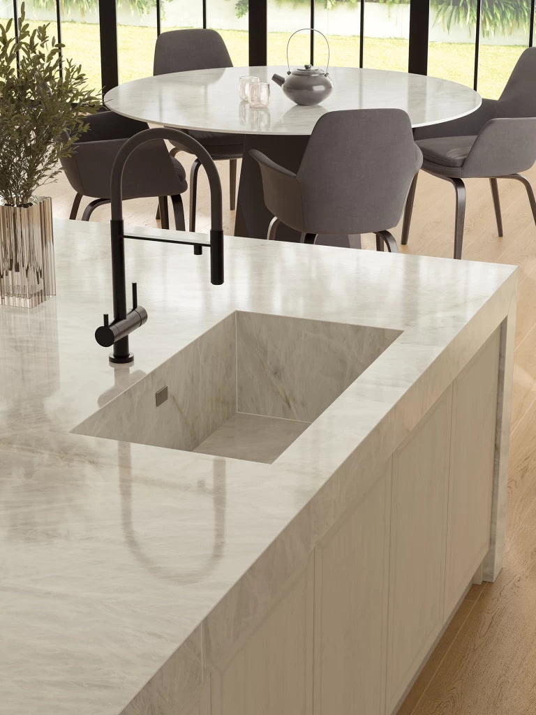 Crystal White quartz kitchen island with integrated sink and polished finish — premium stone countertops installed by Signature Stone Las Vegas
