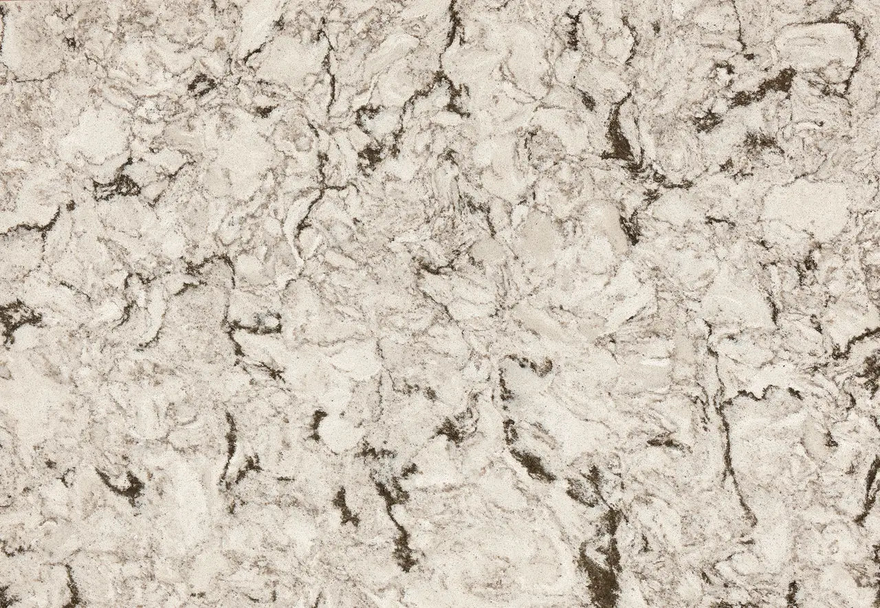 Axbridge quartz slab surface with warm beige tones and intricate dark veining throughout — custom countertops fabricated and installed by Signature Stone LV