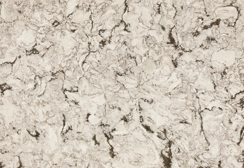 Axbridge quartz slab surface with warm beige tones and intricate dark veining throughout — custom countertops fabricated and installed by Signature Stone LV
