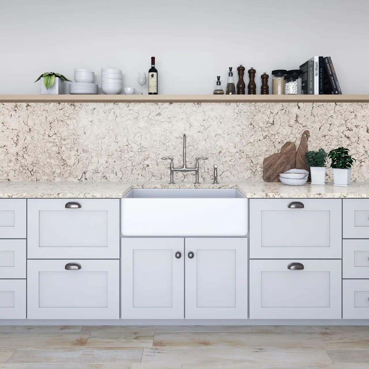 Quartz kitchen countertops with white cabinets and farmhouse sink featuring speckled cream pattern — expert countertop fabrication by Signature Stone Las Vegas