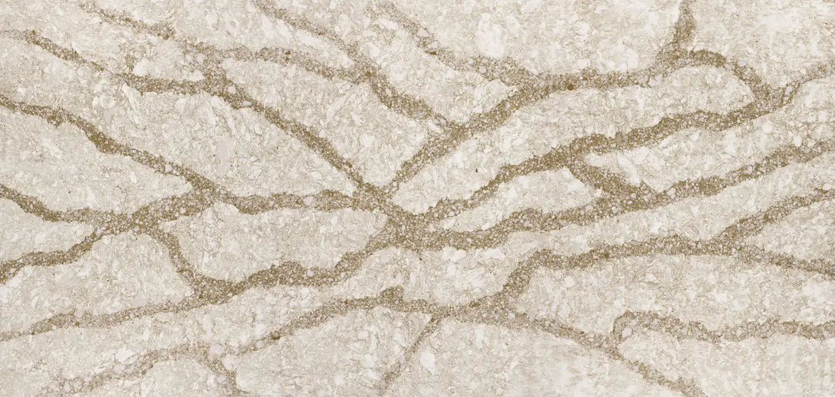 Quartz slab surface with cream and beige veining in polished finish — premium countertop fabrication by Signature Stone Las Vegas