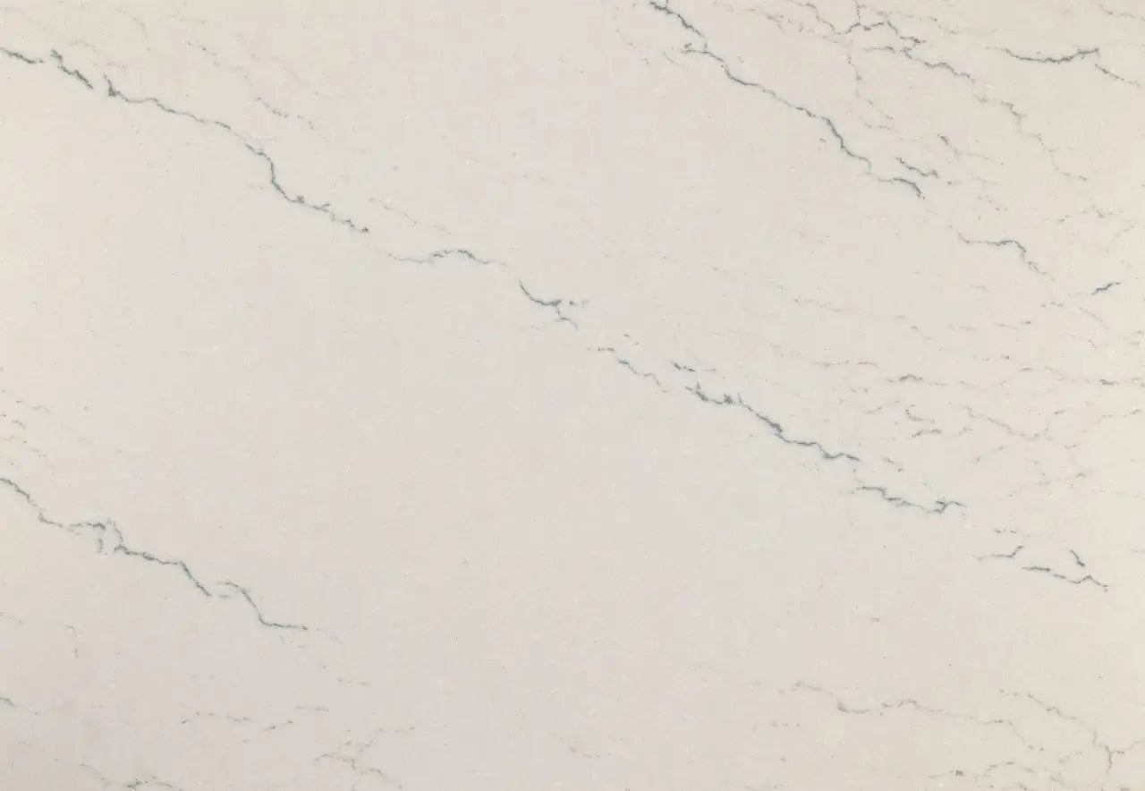 Beckington quartz surface with soft white base and subtle gray veining in polished finish — custom countertops fabricated and installed by Signature Stone LV