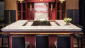 Calacatta marble kitchen island with white veining and waterfall edge — elegant stone countertops installed by Signature Stone Las Vegas