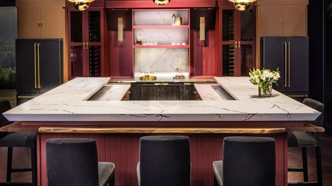 Calacatta marble kitchen island with white veining and waterfall edge — elegant stone countertops installed by Signature Stone Las Vegas