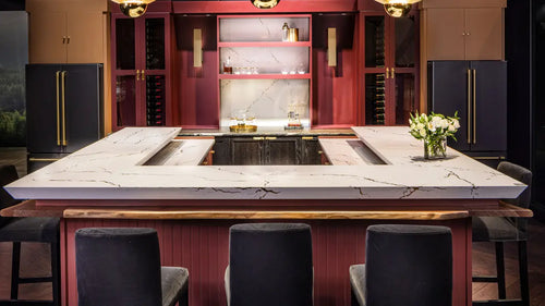 Calacatta marble kitchen island with white veining and waterfall edge — elegant stone countertops installed by Signature Stone Las Vegas