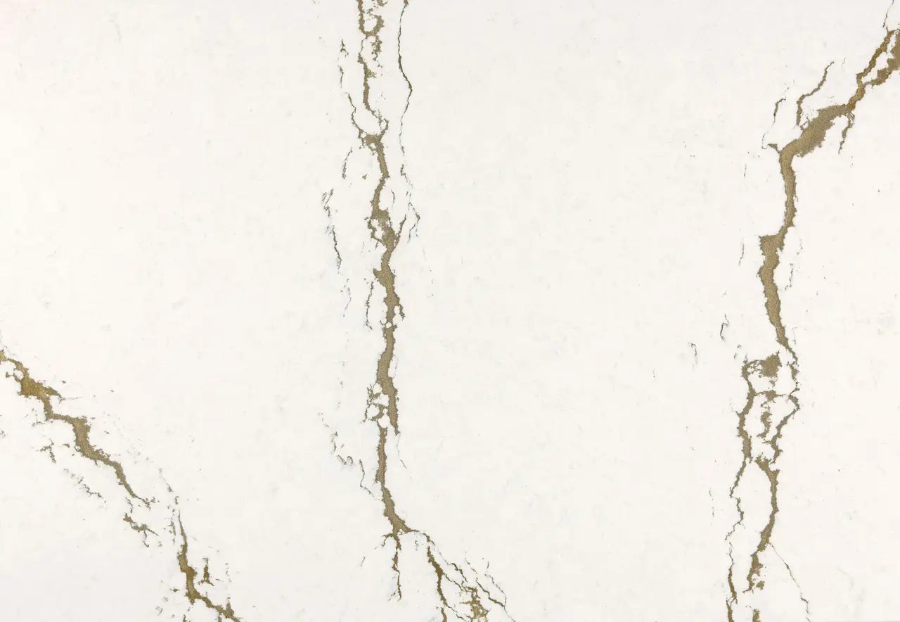 Berkshire Brass Sculpted quartz surface with cream background and gold veining — premium countertop fabrication by Signature Stone Las Vegas