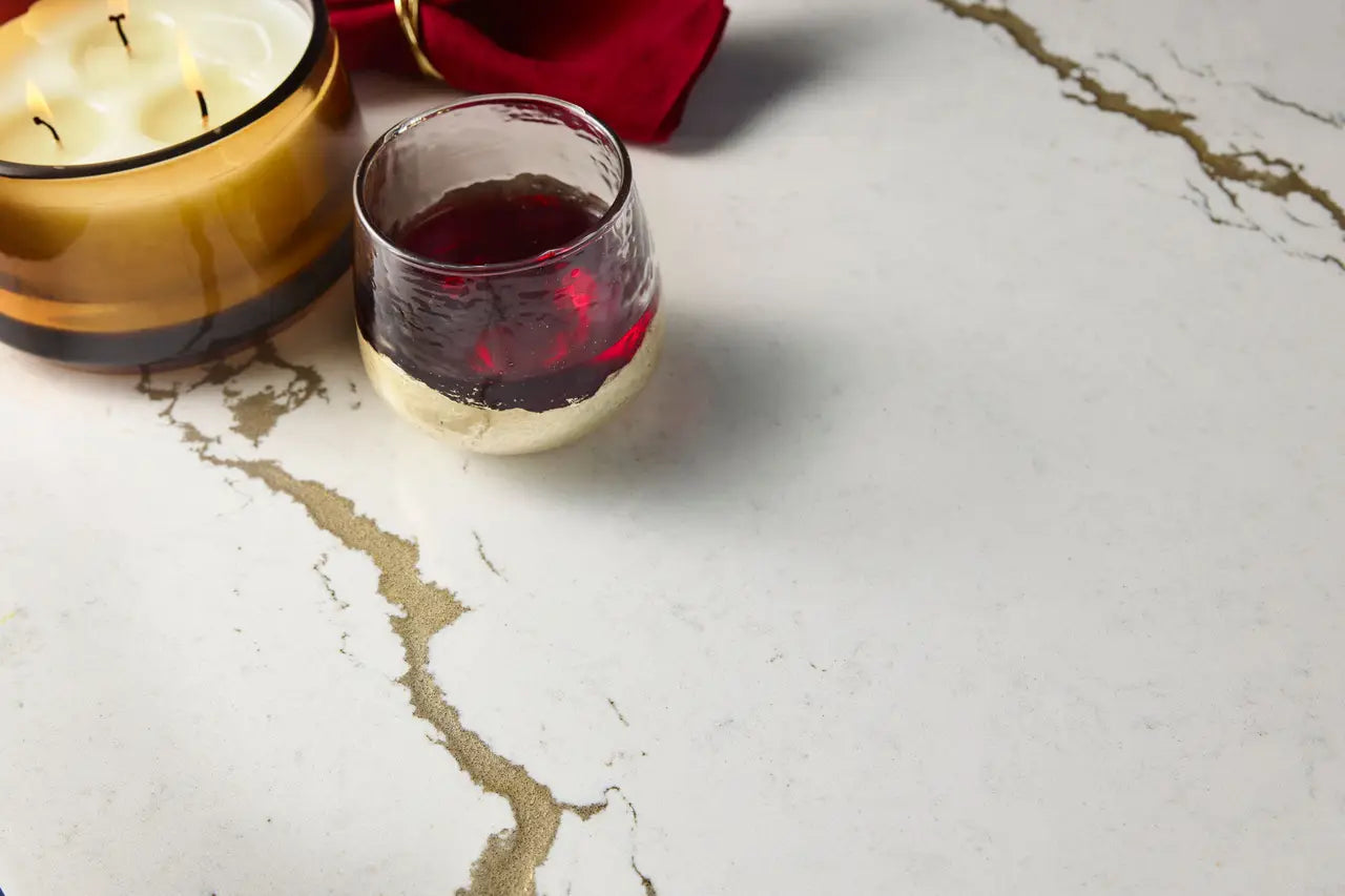 Berkshire Brass Sculpted surface with gold veining and white marble finish — elegant stone countertops installed by Signature Stone Las Vegas