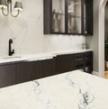 Berkshire Steel Sculpted quartz kitchen countertops with white marble veining and matching backsplash — premium stone countertops installed by Signature Ston...