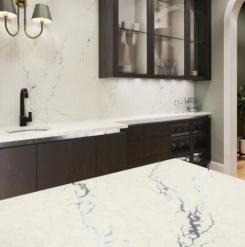 Berkshire Steel Sculpted quartz kitchen countertops with white marble veining and matching backsplash — premium stone countertops installed by Signature Ston...