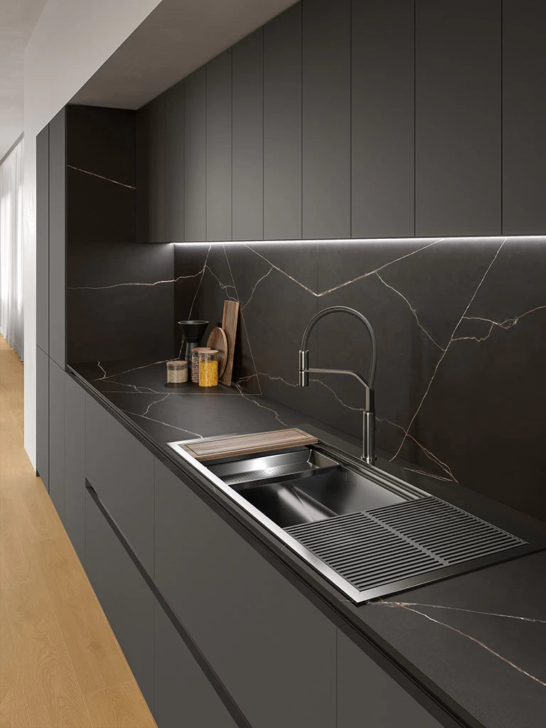 Black Atlantis quartz kitchen countertops with white veining and undermount sink — custom countertops fabricated and installed by Signature Stone LV