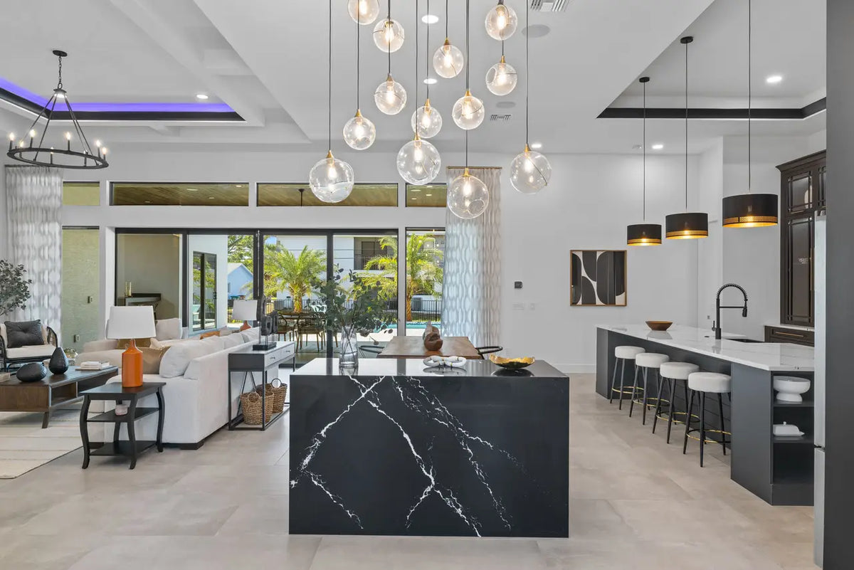 Blackbrook quartz kitchen island with dramatic white veining and waterfall edge — custom countertops fabricated and installed by Signature Stone LV