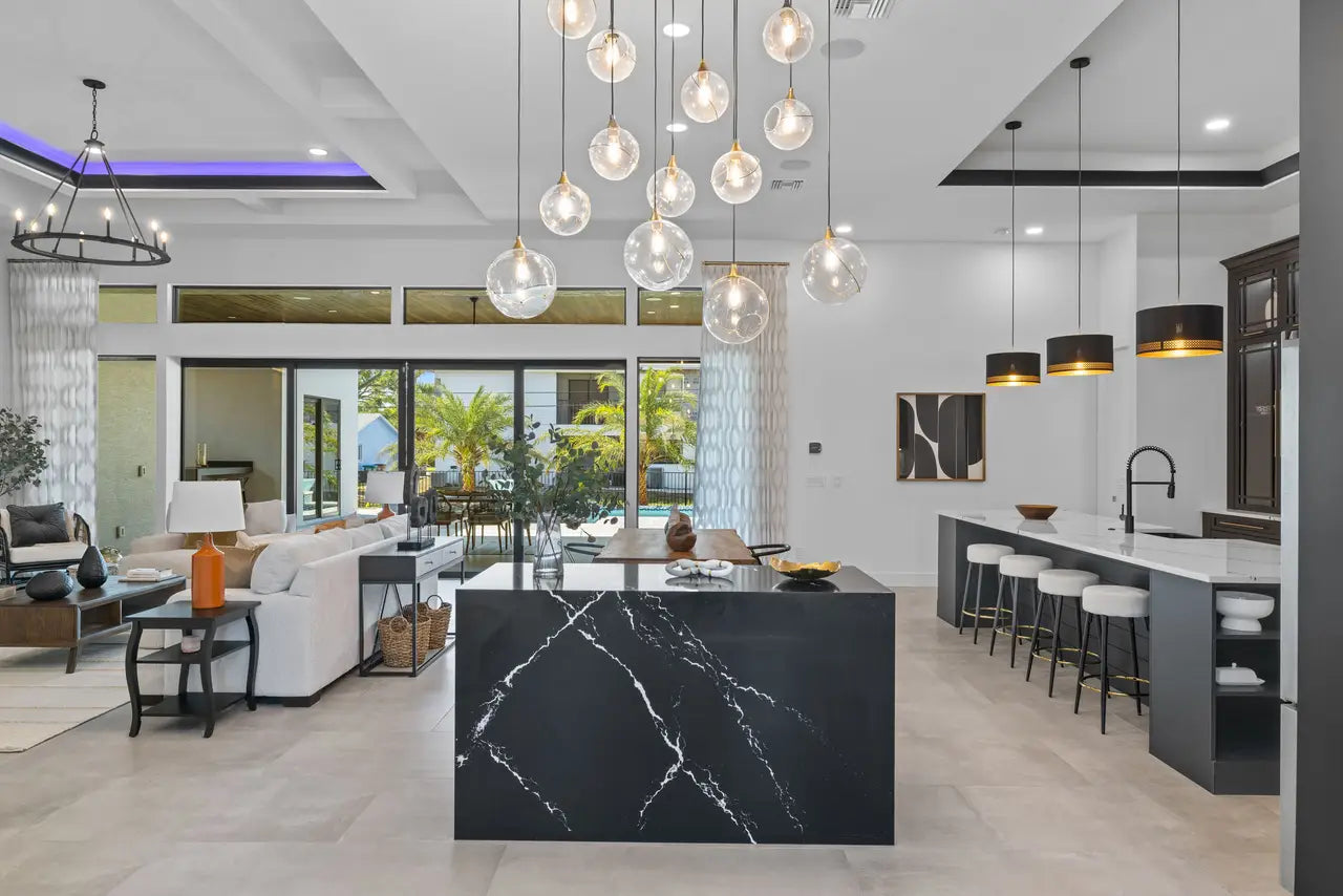 Blackbrook quartz kitchen island with dramatic white veining and waterfall edge — custom countertops fabricated and installed by Signature Stone LV