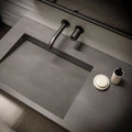 Quartz bathroom vanity with integrated rectangular sink and matte gray finish — modern stone countertops installed by Signature Stone Las Vegas