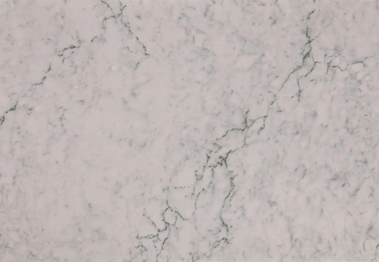Bridport marble surface featuring white base with subtle gray veining and natural stone patterns — custom countertops fabricated and installed by Signature S...