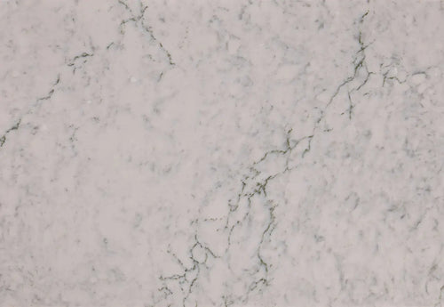 Bridport marble surface featuring white base with subtle gray veining and natural stone patterns — custom countertops fabricated and installed by Signature S...