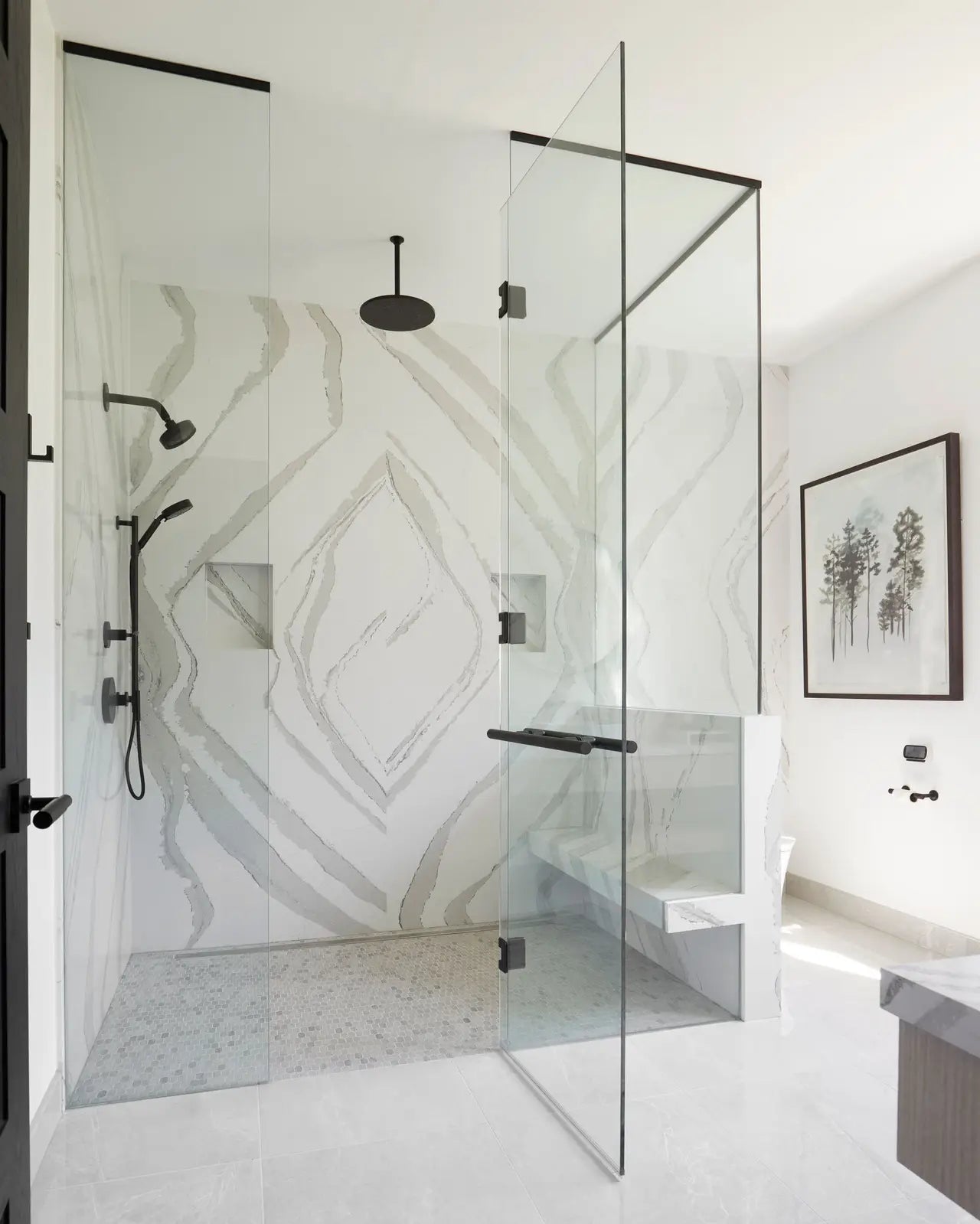 Brittanicca quartz shower walls with dramatic white and gray veining in geometric diamond pattern — expert countertop fabrication by Signature Stone Las Vegas
