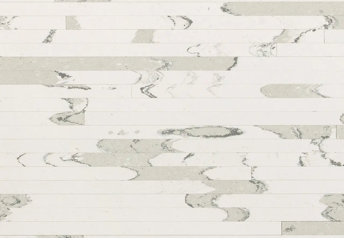 Brittanicca Block quartz surface with white background and gray veining in rectangular plank layout — custom countertops fabricated and installed by Signatur...