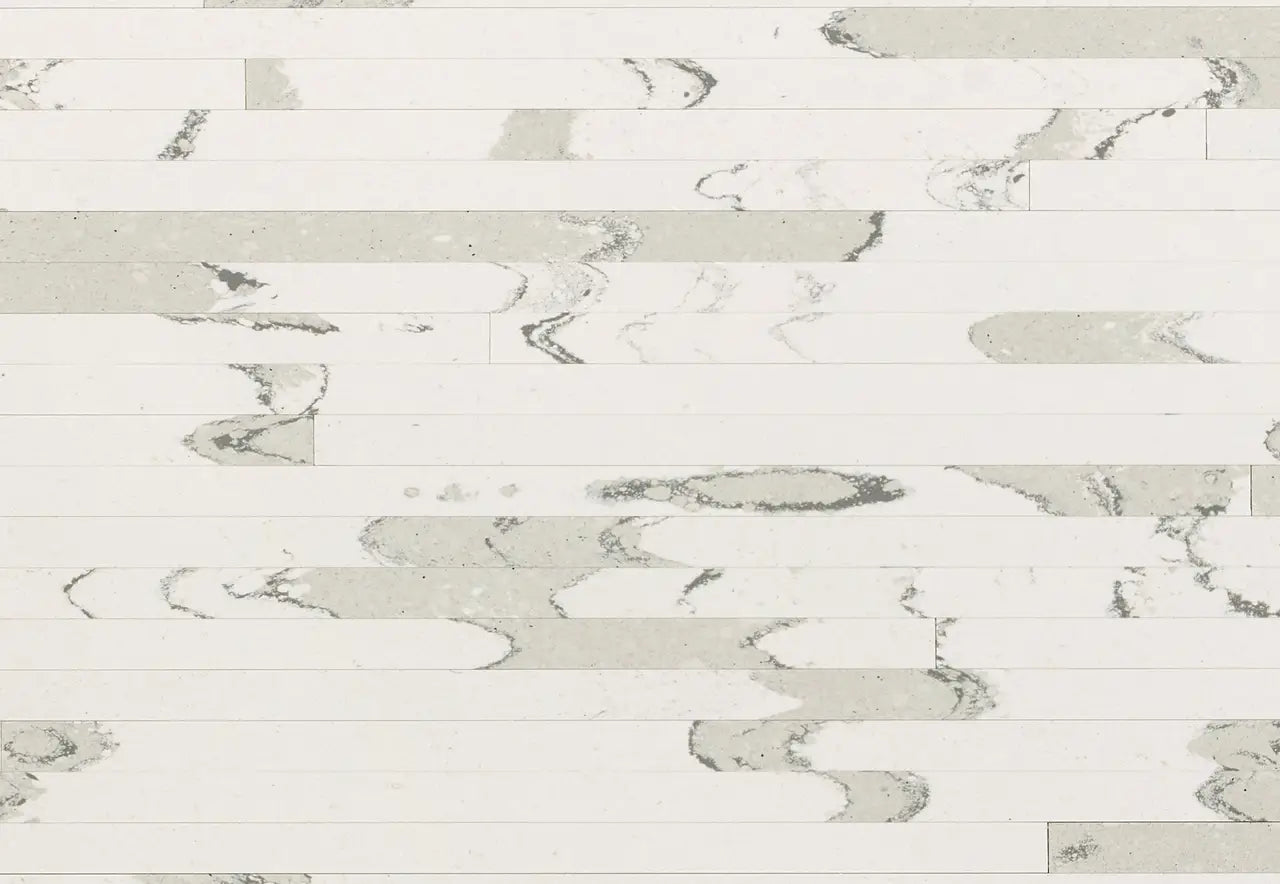 Brittanicca Block quartz surface with white background and gray veining in rectangular plank layout — custom countertops fabricated and installed by Signatur...