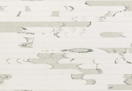 Brittanicca Block quartz surface with white background and gray veining in rectangular plank layout — custom countertops fabricated and installed by Signatur...