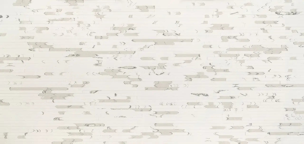Brittanicca Block stone surface with white background and subtle gray veining — professional countertop fabrication by Signature Stone Las Vegas
