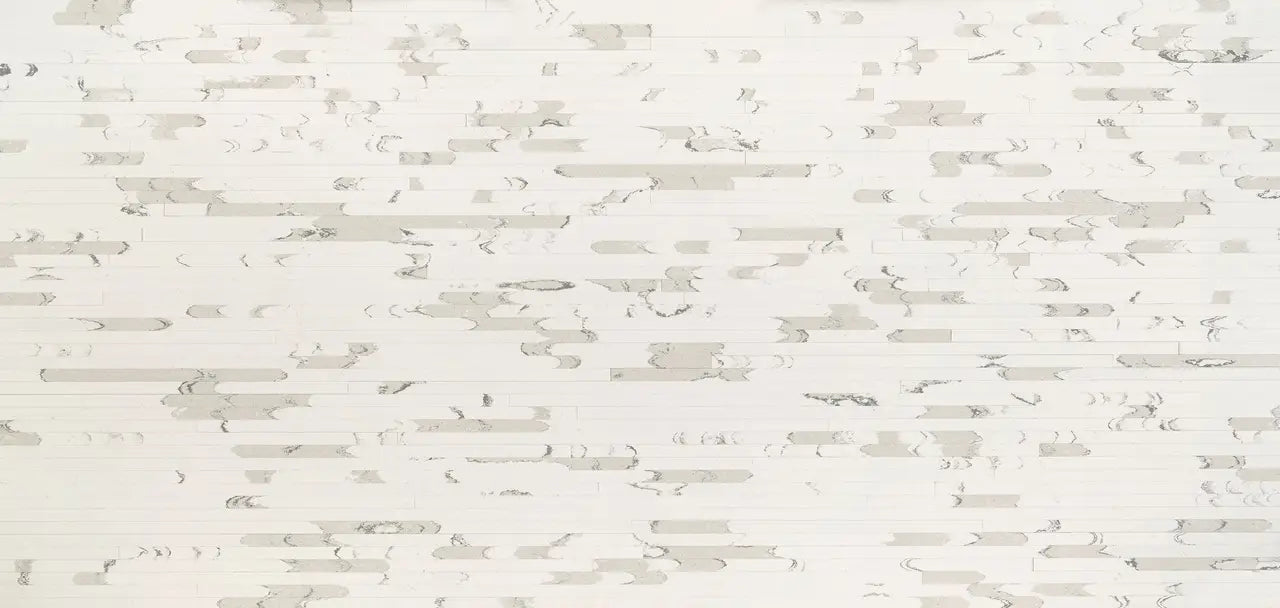 Brittanicca Block stone surface with white background and subtle gray veining — professional countertop fabrication by Signature Stone Las Vegas