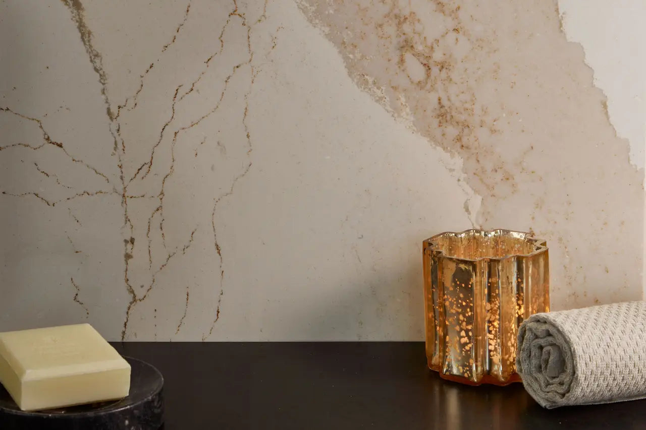 Brittanicca Gold Cool quartz bathroom vanity with elegant white and gold veining — custom countertops fabricated and installed by Signature Stone LV