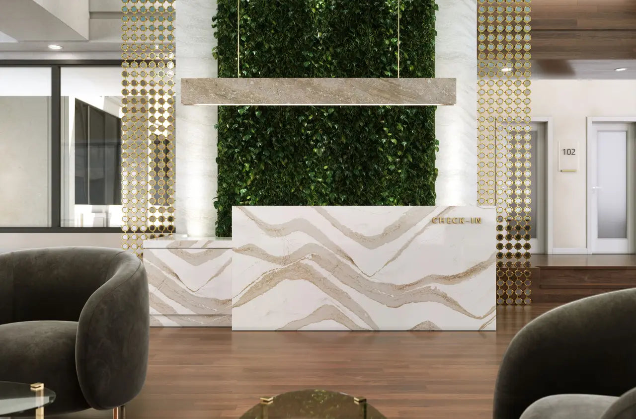 Brittanicca Gold Cool quartz reception desk with dramatic white and gold veining — premium stone countertops installed by Signature Stone Las Vegas