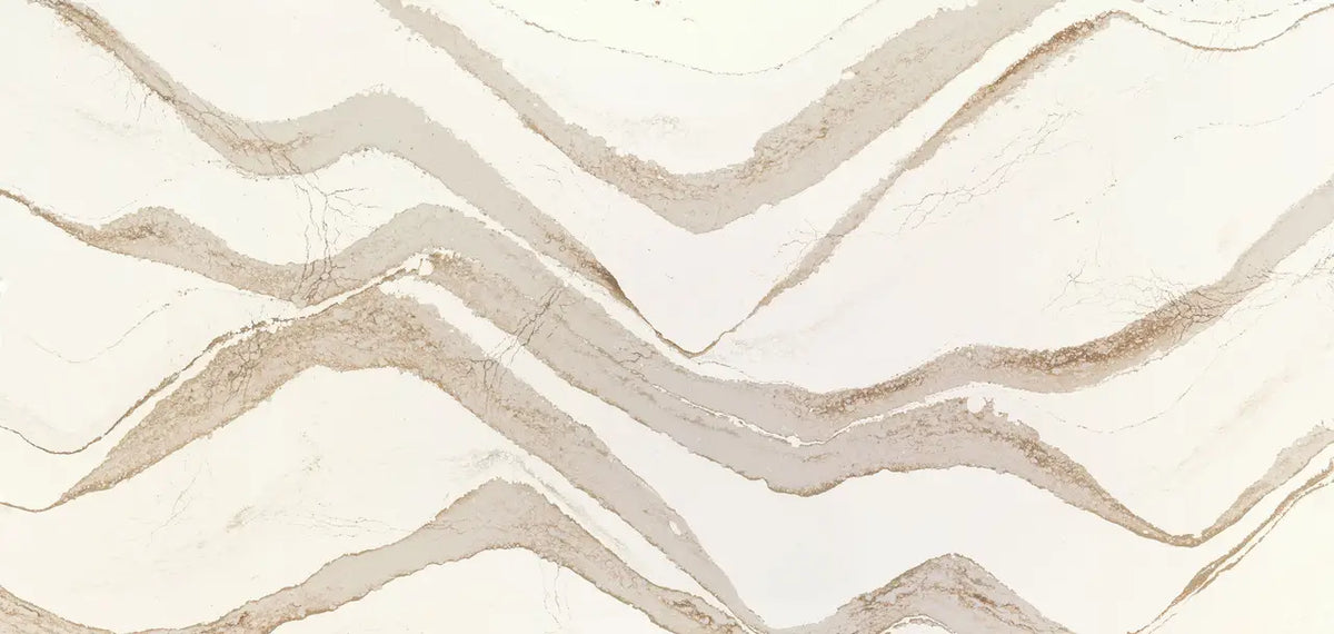 Brittanicca Gold Cool marble slab featuring flowing beige and cream veining patterns — premium stone countertops installed by Signature Stone Las Vegas