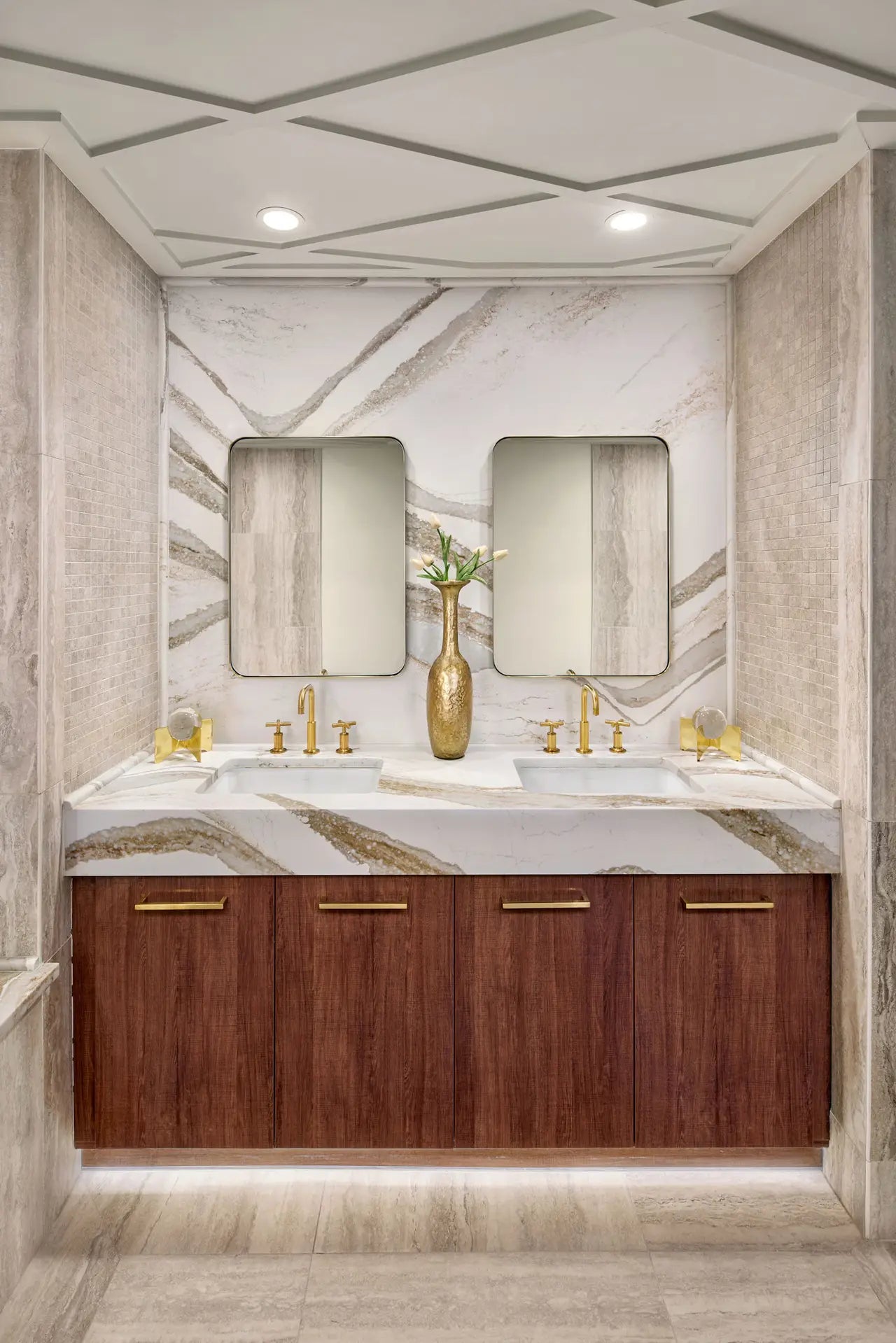 Brittanicca Gold Warm marble bathroom vanity with white base and gold veining — premium countertop fabrication by Signature Stone Las Vegas