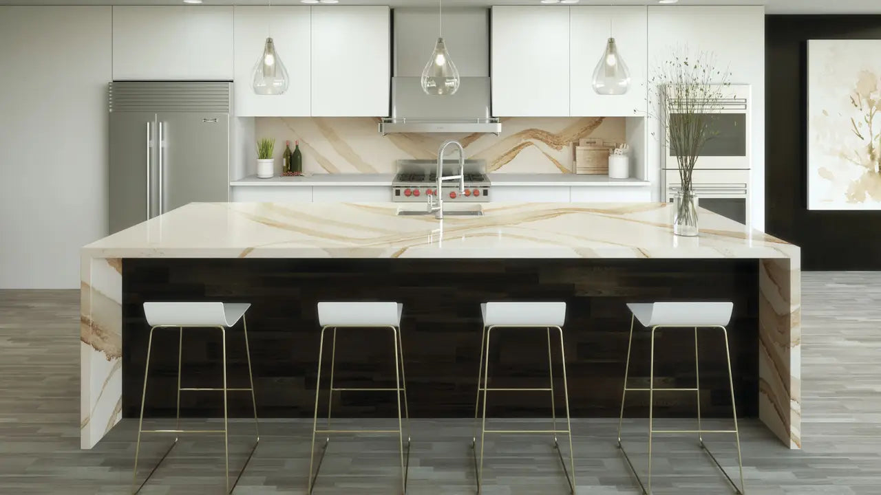 Brittanicca Gold Warm quartz kitchen island with waterfall edge and white veining — premium countertop fabrication by Signature Stone Las Vegas