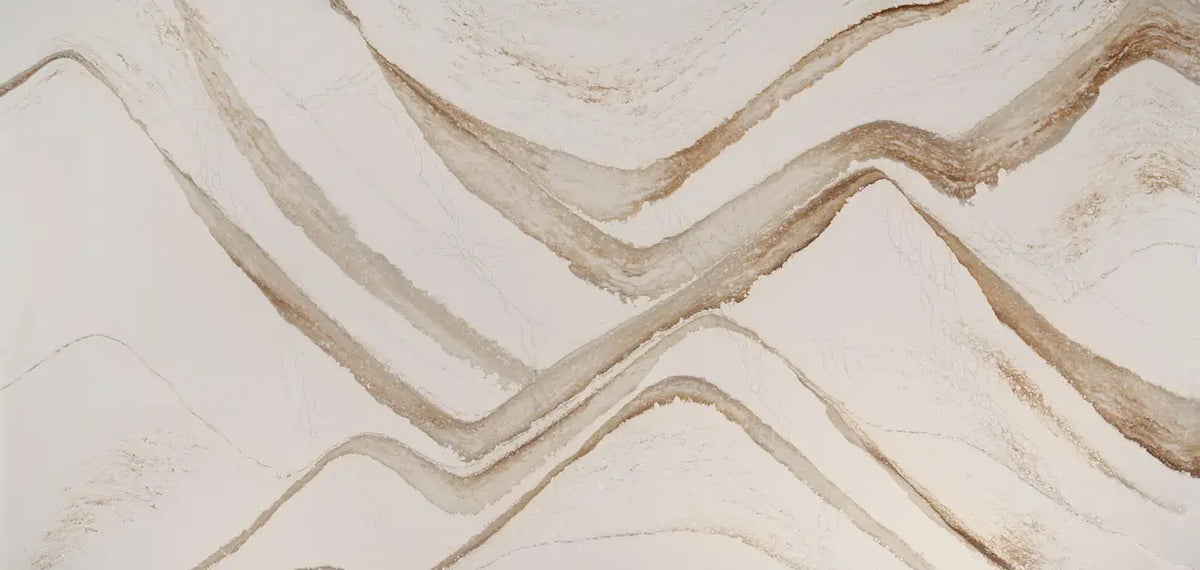 Brittanicca Gold Warm quartz surface with flowing golden veining and polished finish — custom countertops fabricated and installed by Signature Stone LV