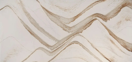 Brittanicca Gold Warm quartz surface with flowing golden veining and polished finish — custom countertops fabricated and installed by Signature Stone LV