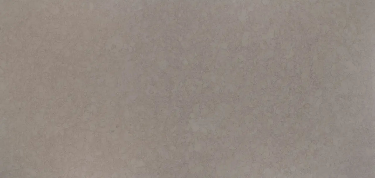 Quartz surface with subtle beige and cream veining in smooth polished finish — premium countertop fabrication by Signature Stone Las Vegas
