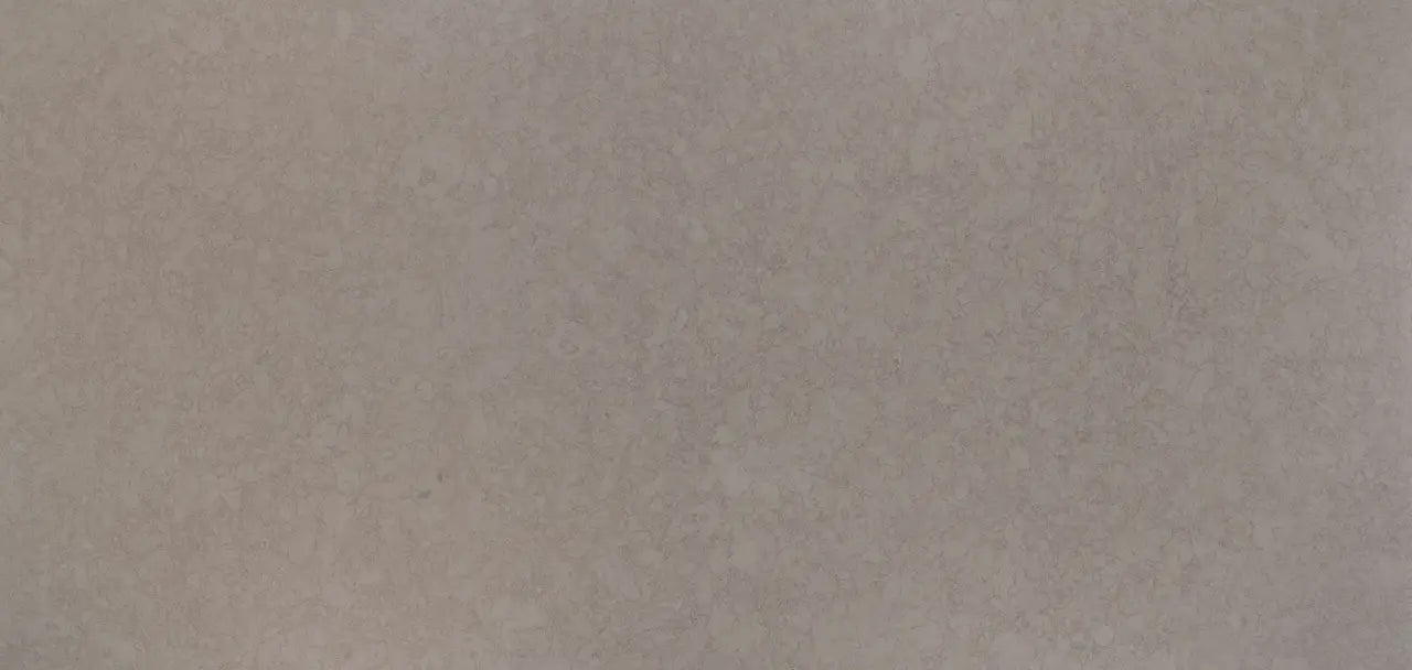 Quartz surface with subtle beige and cream veining in smooth polished finish — premium countertop fabrication by Signature Stone Las Vegas