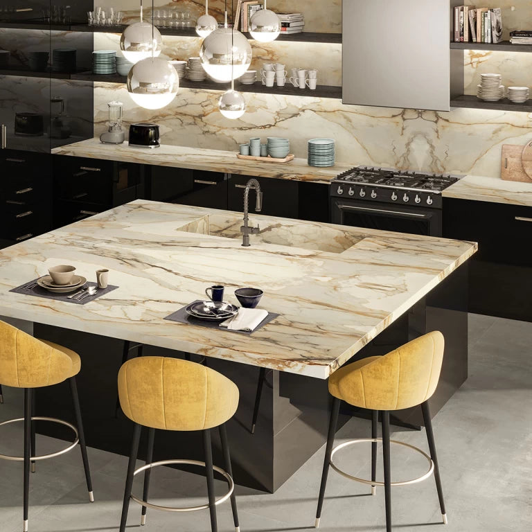 Calacatta Antique kitchen island with dramatic white marble veining and modern black base — custom countertops fabricated and installed by Signature Stone LV