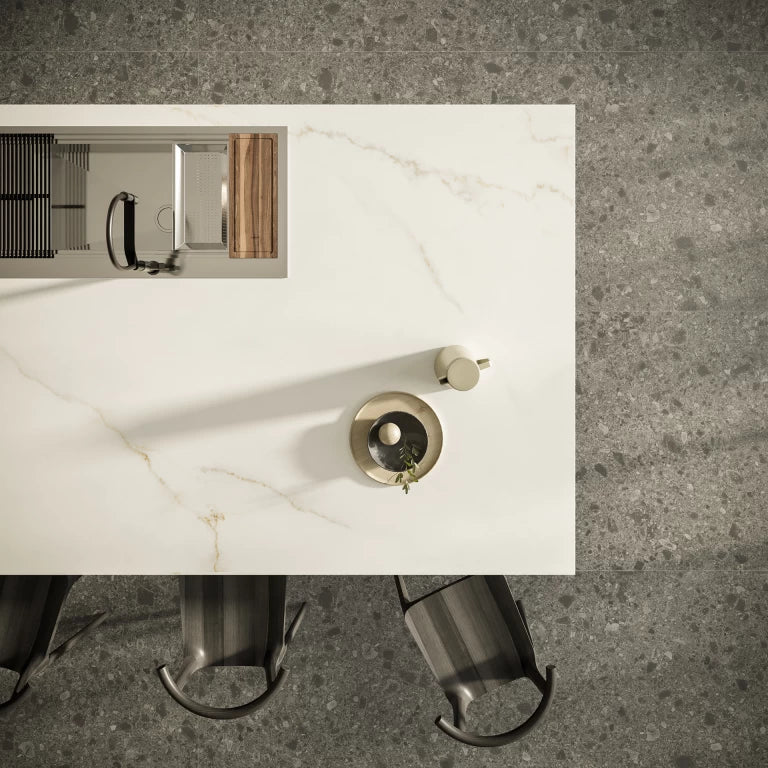 Calacatta Apuano marble kitchen island with white veining and gold fixtures — premium stone countertops installed by Signature Stone Las Vegas