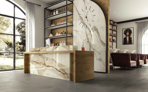 Calacatta Imperiale kitchen island with white marble veining and wood accents — custom countertops fabricated and installed by Signature Stone LV